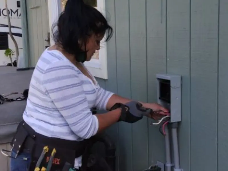 Licensed electrician wiring an exterior subpanel in Sunnyvale